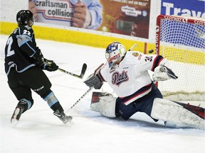 Austin Schellenberg of the Kootenay Ice gets a shot past Regina Pats goalie  Dean McNabb in WHL action at the Brandt Centre on Wednesday.