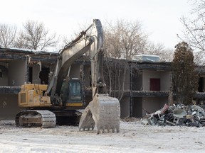 A machine working on the demolition of a building on the former CNIB property in Wascana Park off Broad Street sits idle.