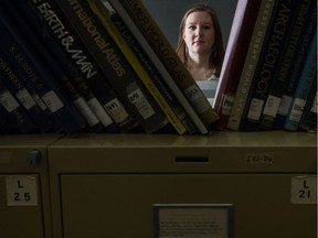 Emily Eaton, a professor in the department of geography and environmental science at the U of R, stands in the map library in the university's classroom building. Eaton is working on a research project  for which she filed a freedom of information request to the university. The university denied her request and she is now appealing the decision.