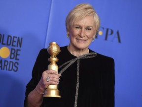 Glenn Close poses in the press room at the 76th annual Golden Globe Awards with the award for best performance by an actress in a motion picture, drama for "The Wife" on Sunday, Jan. 6, 2019.