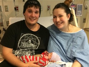 New parents Nick Buchanan and Myriam Albert hold Conor Damon Buchanan on Jan. 1, 2019. Conor weighed in at seven pounds (3.18 kg) and measured 19 inches (48.2 cm).