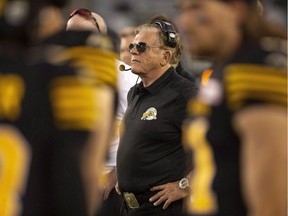 Former Hamilton Tiger-Cats defensive co-ordinator Jerry Glanville on the sidelines during CFL exhibition action against the Toronto Argonauts in Hamilton, Ont. on June 1, 2018. Jerry Glanville would certainly listen if the Saskatchewan Roughriders came calling. The Riders are in the market for a head coach, defensive co-ordinator, general manager and vice-president of football operations after Chris Jones resigned Tuesday to join the Cleveland Browns' coaching staff. The colourful Glanville spent 2018 as the Hamilton Tiger-Cats defensive co-ordinator but left at season's end for personal reasons.
