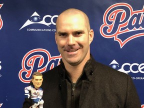 Former Regina Pats captain Barret Jackman poses with his bobblehead on Saturday night at the Brandt Centre.