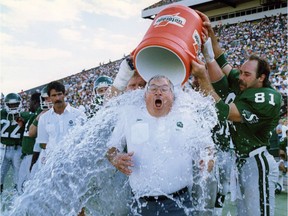 Saskatchewan Roughriders head coach John Gregory is doused by Ray Elgaard - Sept. 03, 1990. Don Healy photo.