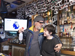 Jeffrey Wimmer, left, a long-time patron jumps at the chance to be photographed with bartender Miranda Holt at Leopold's Tavern in Regina, Saskatchewan on Thursday January 3, 2019. Wimmer has been coming to the bar since it was founded in 2013.