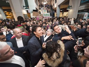 Prime Minister Justin Trudeau poses for selfies during a visit to the University of Regina on Thursday January 26, 2017.