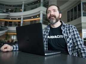 Kai Hutchence, who is organizing this year's Global Game Jam event in Regina, sits in the atrium at Innovation Place.