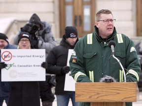 Premier Scott Moe speaks in front of the Legislative Building in Regina at a rally organized in support of the oil and gas industry and resource development.