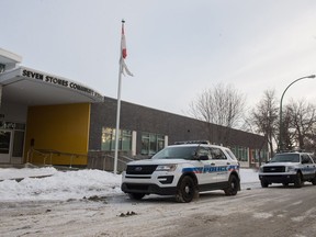 Police vehicles sit outside of Seven Stones Community School on Princess Street.
