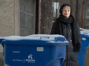 Sarah Truszkowski stands near some recycling bins in an alley near Connaught School. Truszkowski is hoping to see an expansion of the recycling programs in the city's public schools.