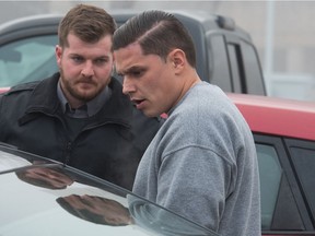 Duran Redwood, right, leaves Regina's Court of Queen's Bench, under the supervision of law enforcement officers. Redwood has been convicted of second-degree murder in the death of his partner Celeste Yawney.