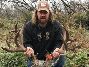Dennis Bennett, a member of the Saskatchewan Wildlife Federation (SWF), poses with his record-breaking kill on Oct. 1, 2018. The non-typical mule deer, which broke both provincial and world records, was killed in the area of Arm River and is the second animal from Saskatchewan to be considered a world-record kill alongside the massive white-tailed deer killed by Milo Hanson in 1993.