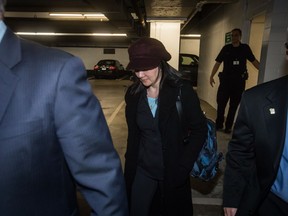 Huawei chief financial officer Meng Wanzhou, who is out on bail and remains under partial house arrest after she was detained Dec. 1 at the behest of American authorities, leaves through an underground parking lot after a court appearance regarding her bail conditions, in Vancouver, on Tuesday January 29, 2019.