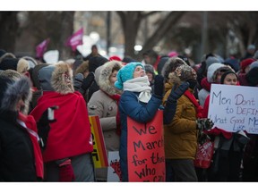 Despite cold weather, the crowd gets into the music and dance prior to the Regina Women's March, which weaved its way through the city's downtown on a cold winter day. BRANDON HARDER/ Regina Leader-Post