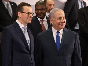 WARSAW, POLAND - FEBRUARY 14:  Polish Prime Minister Mateusz Morawiecki (L) and  Israeli Prime Minister Benjamin Netanyahu attend the group photo at the Ministerial to Promote a Future of Peace and Security in the Middle East on February 14, 2019 in Warsaw, Poland. The ministerial is a conference on the Middle East sponsored by the Polish and U.S. governments. Many European countries are only sending junior representatives or leaving the two-day conference early as E.U. and U.S. policies towards the Middle East and Iran have increasingly diverged since the Trump administration took power.