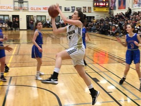 Claire Ledingham of the Luther Lions drives to the basket against the Winnipeg Sturgeon Heights Huskies during senior girls action at the Luther Invitational Tournament on Thursday.