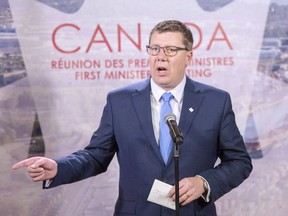 Saskatchewan Premier Scott Moe speaks to the media at the First Ministers conference in Montreal on December 7, 2018. Legal experts, government officials, industry leaders -- and maybe even the public -- will watch this week as Saskatchewan and Ottawa head to court over the constitutionality of a federally-imposed carbon tax. The federal government is set to impose a carbon tax on provinces that do not have one of their own starting in 2019.