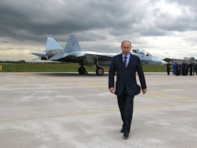 Russian Prime Minister Vladimir Putin walks after inspecting a new Russian fighter jet after its test flight in Zhukovksy, outside Moscow, Russia, on June 17, 2010. New Russian moves in the Arctic have renewed debate over that country's intentions and Canada's own status at the top of the world. Late last month, the Russian newspaper Izvestia reported that country's military will resume fighter patrols to the North Pole for the first time in 30 years. Those patrols will be in addition to regular bomber flights up to the edge of U.S. and Canadian airspace.
