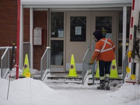 SaskEnergy employees perform gas line repair work around Coronation Park Community School.