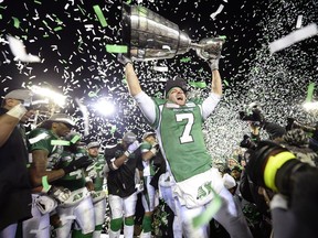 REGINA, SASK - Nov. 24, 2013  -  Saskatchewan Roughriders slotback Weston Dressler (#7) hoists the Grey Cup at the end of the 101st Grey Cup game held at Mosaic Stadium in Regina, Sask. on Sunday Nov. 24, 2013.