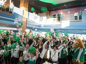 Saskatchewan Roughriders fans celebrate Thursday after it was announced that the 2020 Grey Cup will be held at Mosaic Stadium.