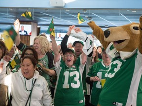 Fans at Mosaic Stadium cheer upon hearing Thursday's announcement that Saskatchewan will host the Grey Cup in 2020.