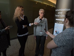 Dr. Tania Diener, second from right, medical director for immunization travel health for the SHA, speaks to members of the media regarding measles, in the building that houses the immunization and travel clinic on Hamilton Street.