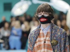 FILE - In this Feb. 21, 2018, file photo, a model wears a creation as part of the Gucci women's Fall/Winter 2018-2019 collection, presented during the Milan Fashion Week, in Milan, Italy. Gucci, which designed this face warmer, reminiscent of blackface prompted an instant backlash from the public and forced the company to apologize publicly on Wednesday, Feb. 6, 2019.