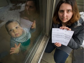 Quarantined: Mom Stefania Seccia shows proof of her and her husband's own measles vaccination as her baby Max is stuck at home under quarantine after being exposed to the virus as B.C. Children's Hospital. Max is too young to be vaccinated.