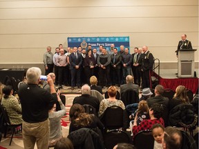 A group of people stand together at the Regina Police Service Awards held at the Delta Hotel on Saskatchewan Drive. The group was responsible for a police effort to manage illegal marijuana dispensaries in Regina prior to legalization.