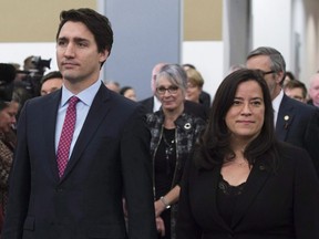 Prime Minister Justin Trudeau and then-Minister of Justice and Attorney General of Canada Jody Wilson-Raybould take part in the grand entrance as the final report of the Truth and Reconciliation commission is released, Tuesday December 15, 2015 in Ottawa.