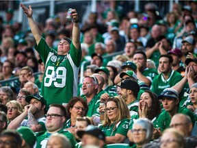 REGINA, SASK : July 5, 2018  -- A Saskatchewan Roughriders fan calls for noise during a game against the Hamilton Tiger-Cats at Mosaic Stadium. BRANDON HARDER/ Regina Leader-Post