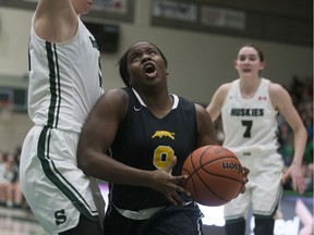 The University of Regina Cougars' Kyanna Giles, shown driving to the basket during Friday's Canada West women's basketball final against the host University of Saskatchewan Huskies, is nursing a leg injury leading up to nationals.