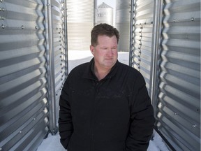 Jeff Hoiness, a canola farmer, with the grain bins at his farm near Allan, Sask. on Wednesday, March 6, 2019.