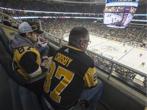 Humboldt Broncos bus crash survivor Layne Matechuk, left and his father Kevin watch the Pittsburgh Penguins take on the Washington Capitals at PPG Paints Arena in Pittsburg, Pennsylvania on Tuesday, March 12, 2019. Matechuk, who's hockey hero is Penguins team captain Sidney Crosby, was given a tour of the building and team dressing by Crosby on March 12, 2019.
