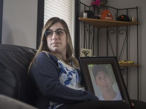 Celina Danis, whose partner died in a workplace accident in 2016, stand for a photograph in her home in Saskatoon on Tuesday, March 19, 2019.