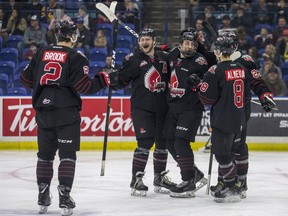 The Moose Jaw Warriors, shown celebrating a goal Friday against the Saskatoon Blades, are down 2-0 in a WHL playoff series heading into Tuesday's game at Mosaic Place.