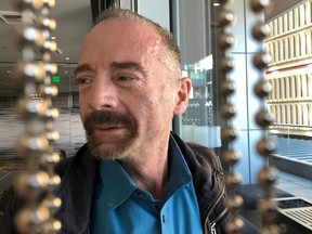 Timothy Ray Brown poses for a photograph, Monday, March 4, 2019, in Seattle. Brown, also known as the "Berlin patient," was the first person to be cured of HIV infection, more than a decade ago.