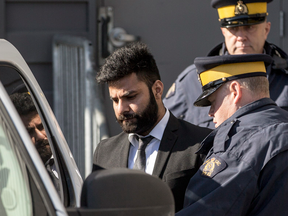 Jaskirat Singh Sidhu, driver of a transport truck involved in the deadly crash with the Humboldt Bronco's bus, is taken into custody after being sentenced to 8 years in prison, in Melfort, Saskatchewan on March 22, 2019.