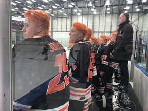 Members of the Saskatoon Contacts show off their orange hairstyles Friday during a Saskatchewan Midget AAA Hockey League playoff game against the Regina Pat Canadians.