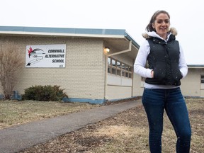 Tara Amyotte, a former student of Cornwall Alternative School, stands in front of the school on Dixon Crescent. Amyotte hopes to rally support for the school in the wake of an announcement that the provincial government would be withdrawing its funding.