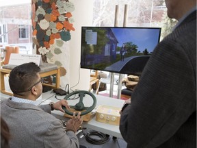 Professor Mark Chignell, right, University of Toronto, shows Trevor Persaud, who works in the Acquired Brian Injury Outreach Team at Wascana Rehabilitation Centre, a product to help those with dementia.  This was part of an event to showcase interactive technological products for older adults held at the Wascana Rehabilitation Centre.