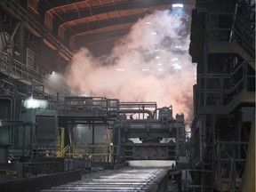 A slab of steel that came out of the furnace at an approximate temperate of 2300 degrees fahrenheit is cooled at Evraz in Regina.