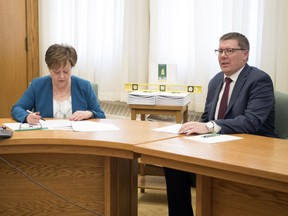 Saskatchewan Finance Minister Donna Harpauer and Premier Scott Moe watch the federal budget speech from the Legislative Building in Regina.