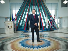 Outgoing First Nations University of Canada president Mark Dockstator stands in the atrium of the university's Regina campus.