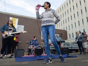 The band Abrupt Dystopia plays during an event held at the edge of the Capital Pointe hole at the corner of Victoria Avenue and Albert Street. The band played a song about the hole. BRANDON HARDER/ Regina Leader-Post