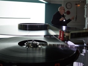 Trevor Ewen, Chief Projectionist at the Kramer IMAX Theatre, does some last minute checks before starting a rare 15/70 format version of Stanley Kubrick's 2001: A Space Odyssey.