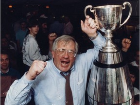 Saskatchewan Roughriders head coach John Gregory celebrates with the Grey Cup in 1989.