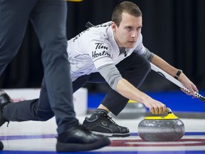 Team Wild Card skip Brendan Bottcher makes a shot during the semifinal draw against team Northern Ontario at the Brier in Brandon, Man., Sunday, March 10, 2019.