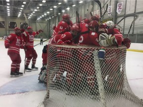 The Notre Dame Hounds mob goaltender Thomas Wardle after defeating the Regina Pat Canadians 4-2 at the Co-operators on Wednesday to win a Saskatchewan Midget AAA Hockey League playoff series.